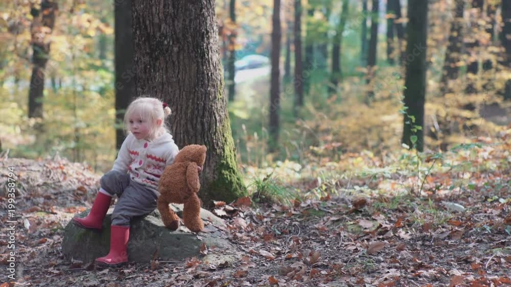 Adorable little girl hiking in the forest on summer day. Happy child girl in forest. Little kid playing in the autumn on the nature walk. Happy family walking with dog in the forest. Adorable little girl hiking in the forest on summer day. Happy child girl in forest. Little kid playing in the autumn on the nature walk. Happy family walking with dog in the forest.