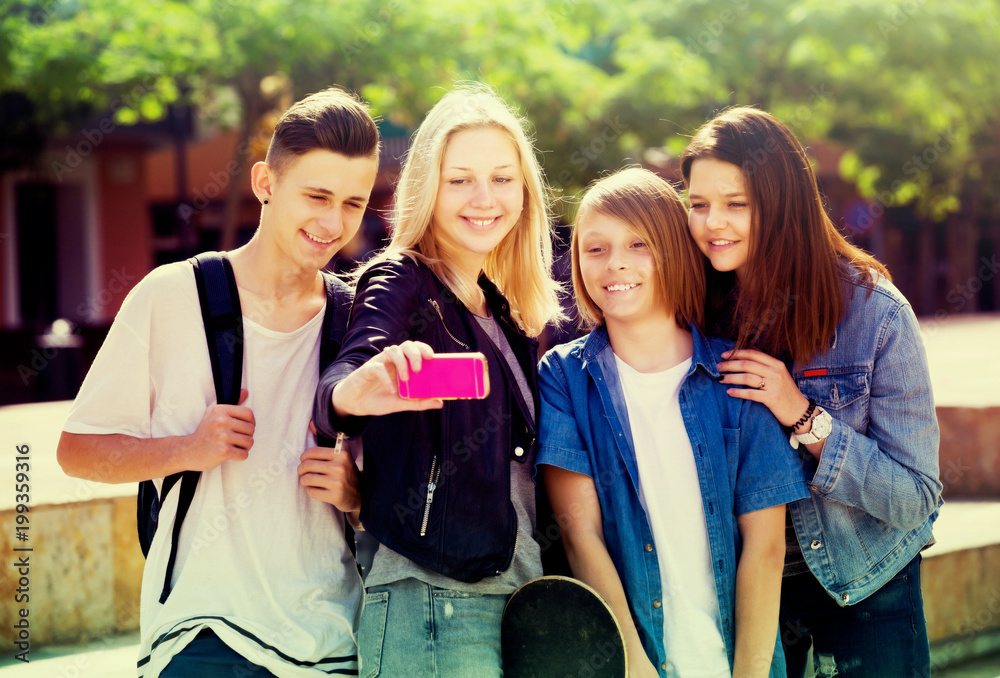Fototapeta premium Teenagers taking mobile self picture