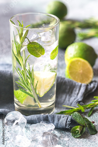 Glass of lime water with herbs