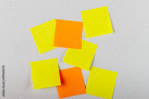 Mock-up lot of yellow empty office stickers on white background