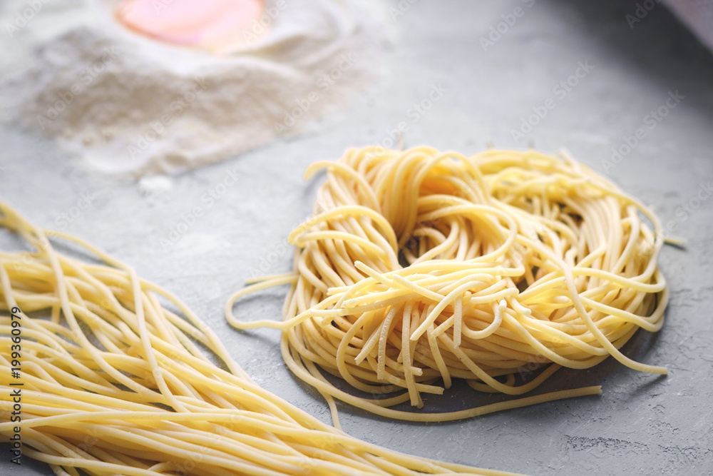 fresh pasta on the table - spaghetti home made fresh pasta on the table - spaghetti home made