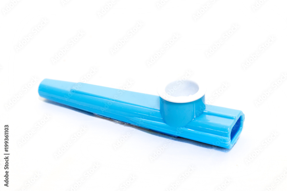 Childrens blue plastic kazoo on a white background Childrens blue plastic kazoo on a white background