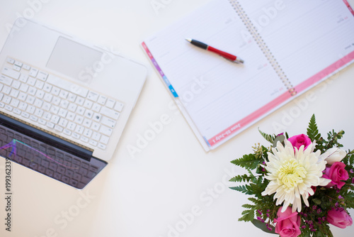 White Desktop with Pink Flowers and Calendar