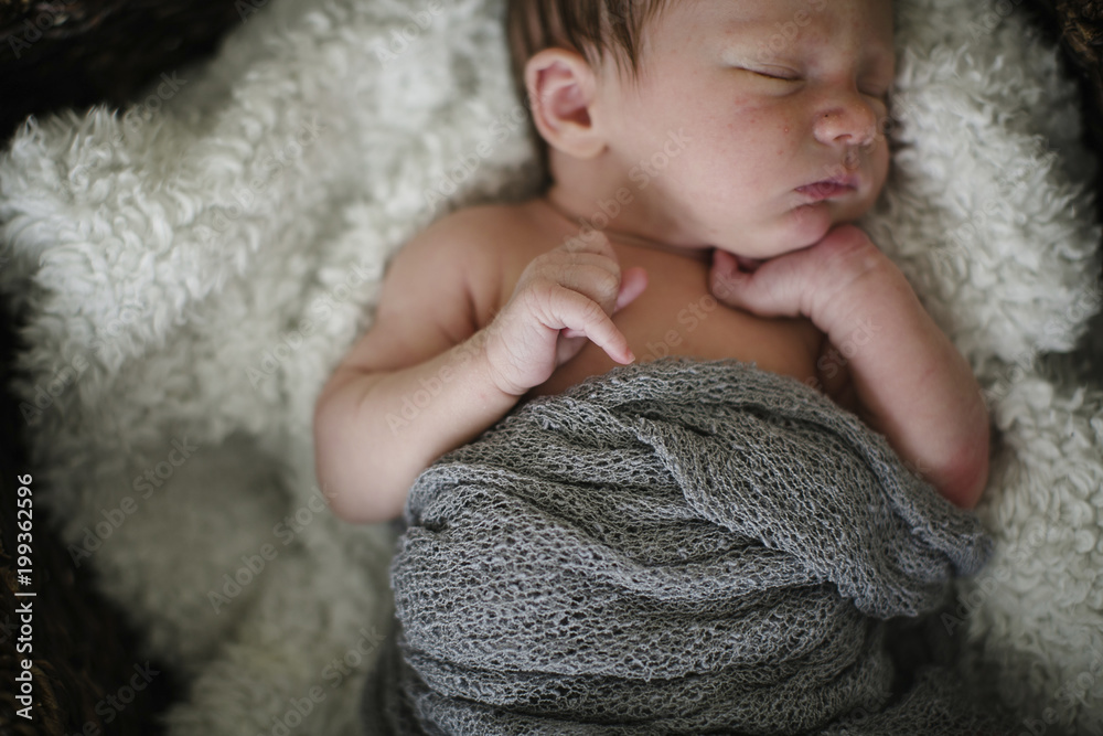 Close up of newborn baby boy sleeping on bed at home Close up of newborn baby boy sleeping on bed at home