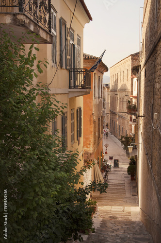 Narrow street of the old part of Nafplio town in Greece © Kana Movana
