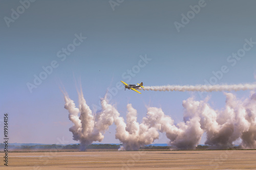 Aerobatics airplane performing a demonstration flight photo