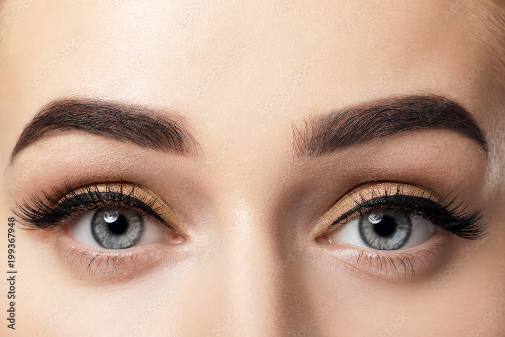 Young woman with beautiful eyebrows after correction, closeup Young woman with beautiful eyebrows after correction, closeup