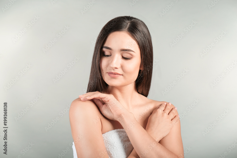 Portrait of beautiful woman on grey background. Cosmetology and spa Portrait of beautiful woman on grey background. Cosmetology and spa