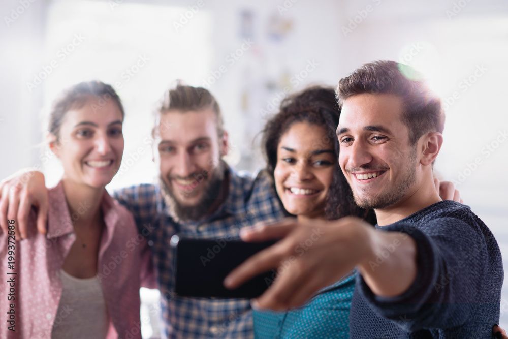 A young multiethnic group of friends who have fun while taking s A young multiethnic group of friends who have fun while taking s