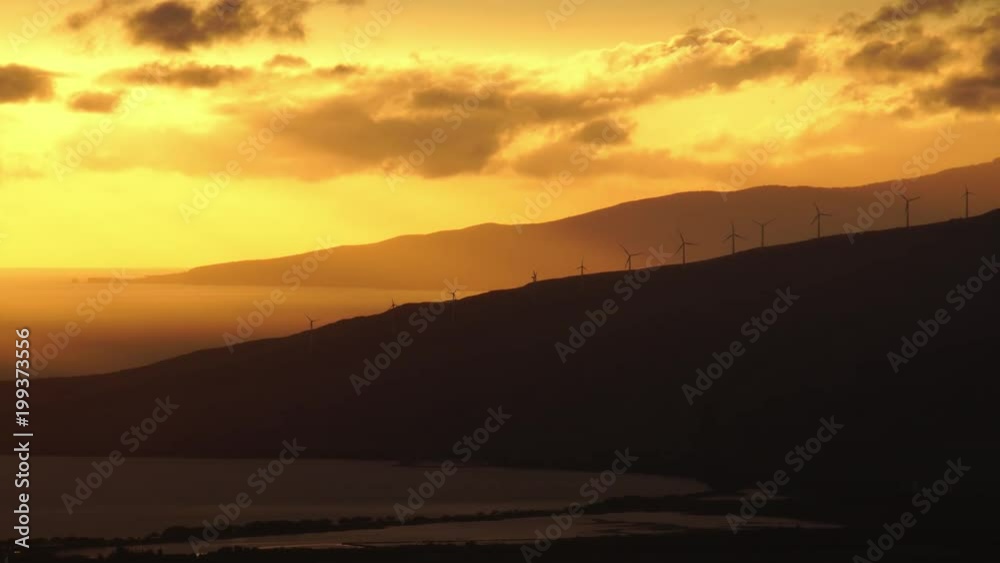 Wind turbine farm at the sunset, renewable electric energy Wind turbine farm at the sunset, renewable electric energy