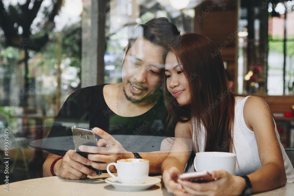 Lovely asian couple having coffee Lovely asian couple having coffee