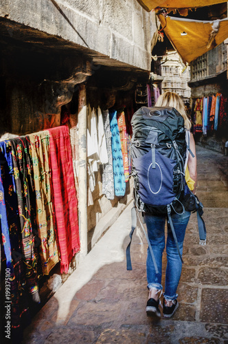 Western backpacker woman exploring India