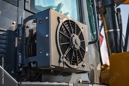 Air conditioner installed at modern industrial agricultural tractor or bulldozer vehicle