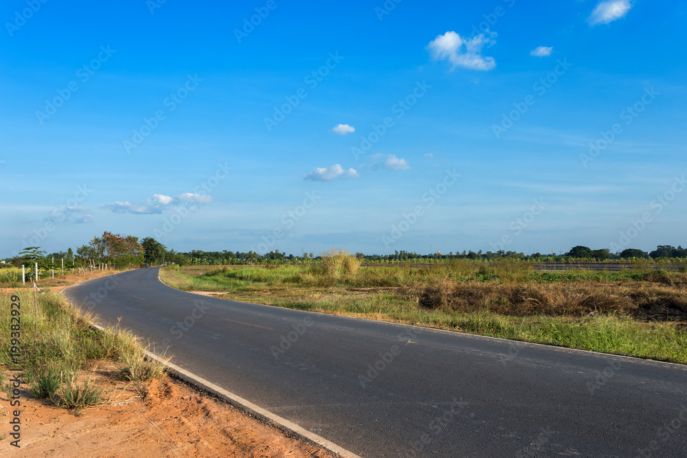 Rural roads Beside with nature and tree big green in fluffy clouds with blue sky background. Rural roads Beside with nature and tree big green in fluffy clouds with blue sky background.
