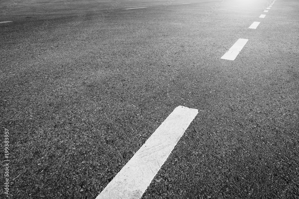 Asphalt road with marking lines white stripes texture Background.