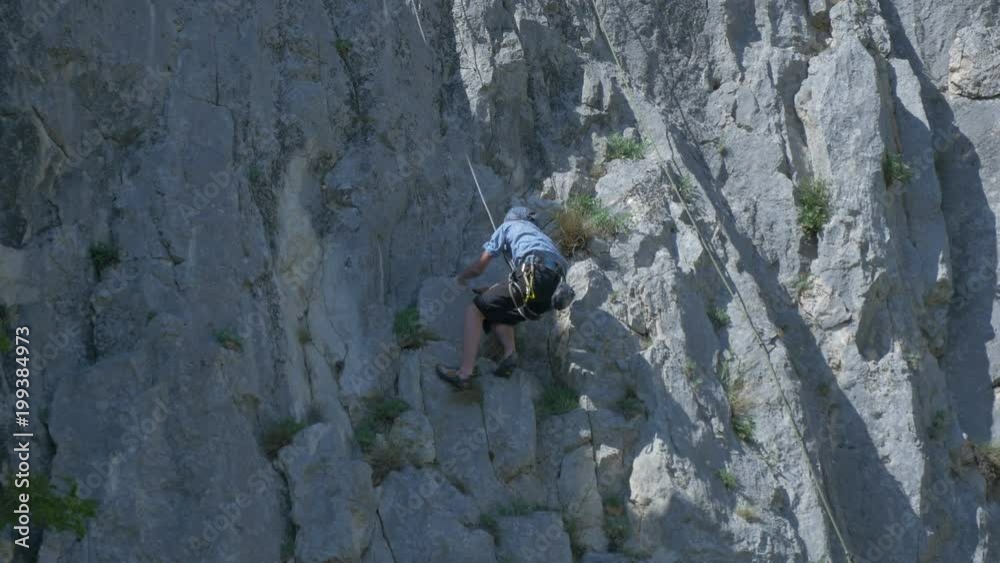 View of a man rock climbing on Piatra Secuiului View of a man rock climbing on Piatra Secuiului