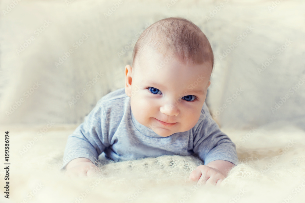 cute baby with blue eyes crawling forward cute baby with blue eyes crawling forward