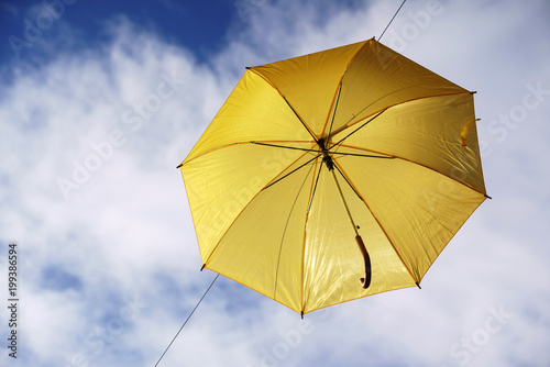 umbrella flying on a blue sky