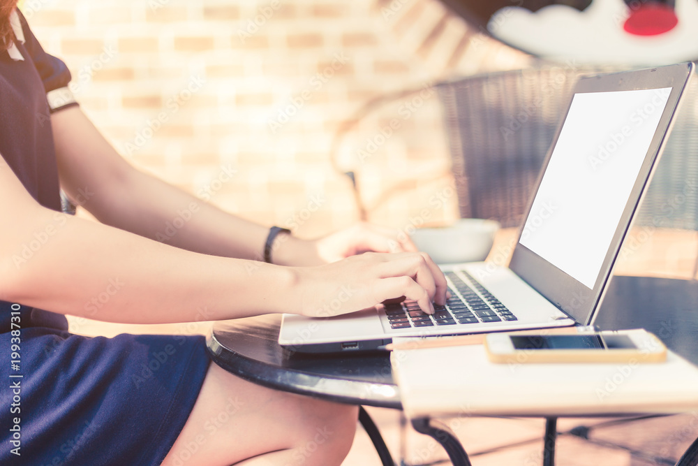 Naklejka premium Business female working with laptop coffee and smart phone on office outdoor.