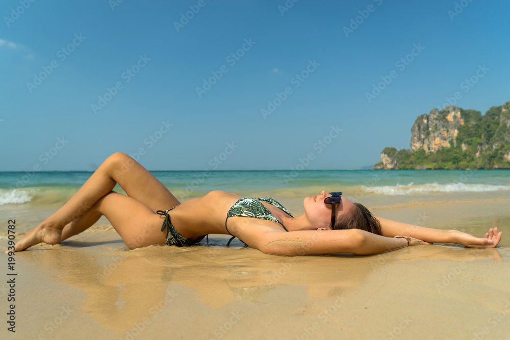 woman resting at the tropical Thailand Railay beach woman resting at the tropical Thailand Railay beach
