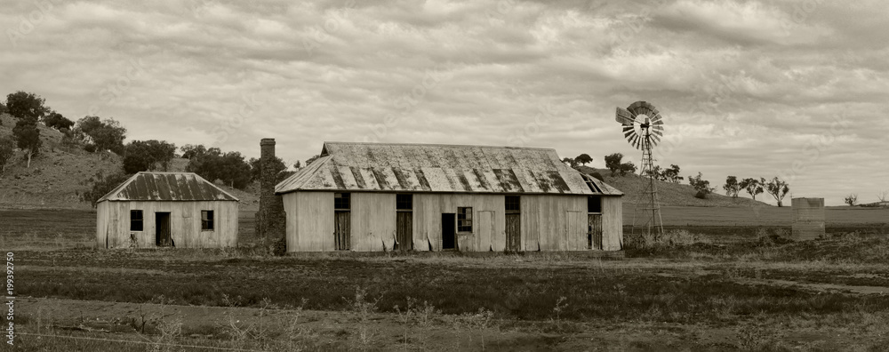 Rural farmlands windmill and outbuildings