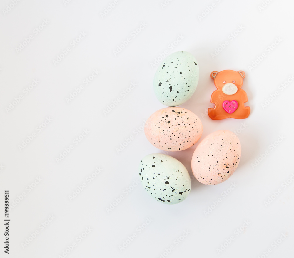 Easter hand painting marbled eggs,cute bear.Minimalistic flat lay.White background.Children holiday concept. Easter hand painting marbled eggs,cute bear.Minimalistic flat lay.White background.Children holiday concept.