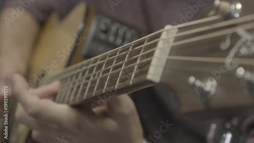 Close up of a person playing the guitar 