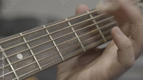 Close up of a hand playing the guitar 
