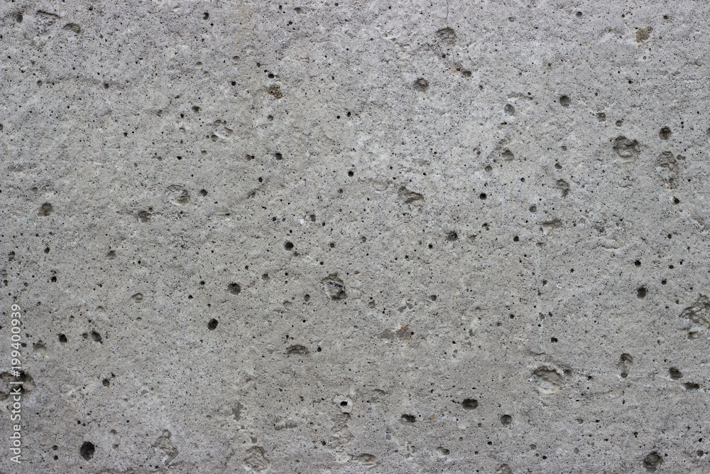 Gray wall of concrete with pores, textures, background. Gray wall of concrete with pores, textures, background.