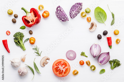 Fototapeta Naklejka Na Ścianę i Meble -  Various fresh vegetables and herbs on white background.Ingredients for cooking concept sweet basil ,tomato ,garlic ,pepper and onion with flat lay..
