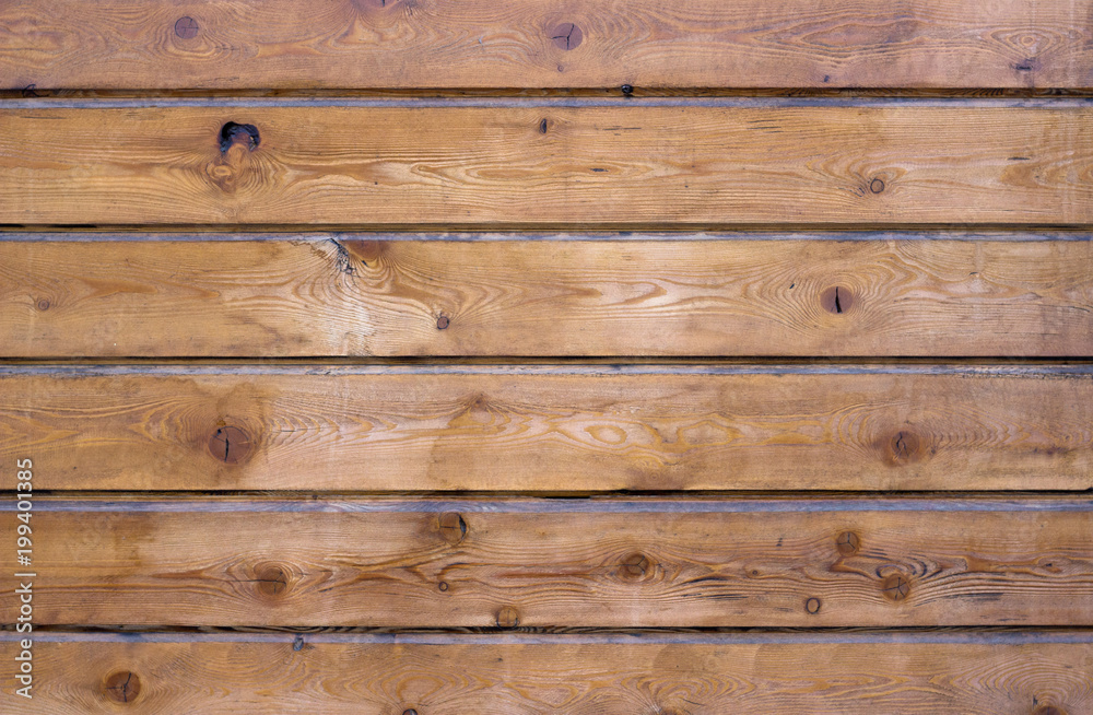 Naklejka premium Brown wooden panels arranged horizontally. Wooden texture & background