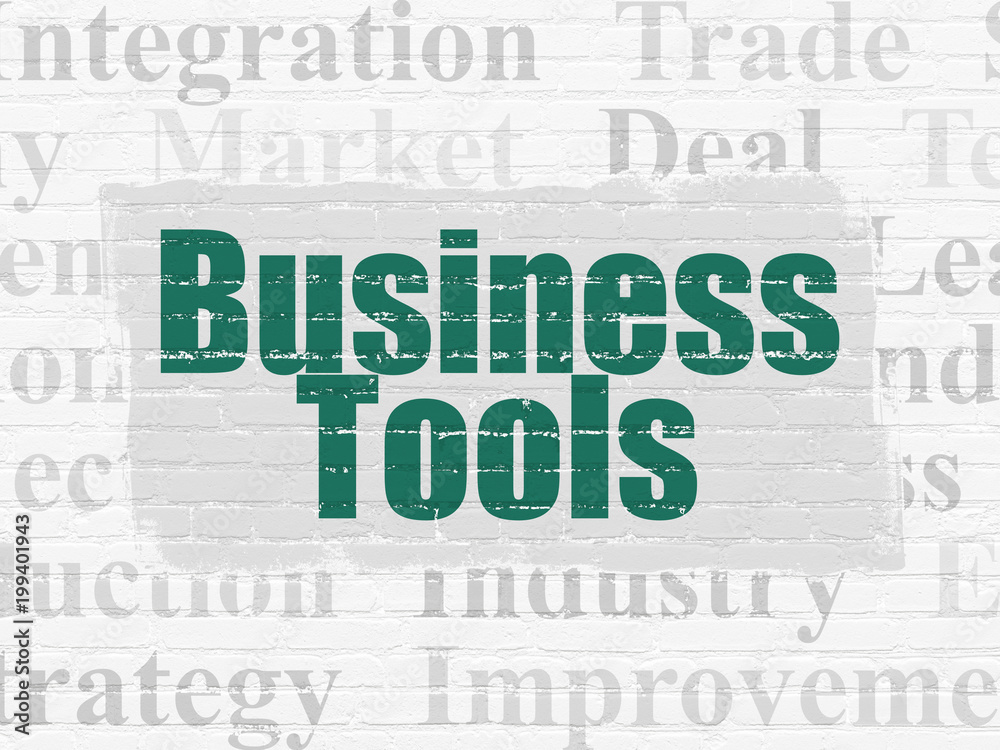Finance concept: Painted green text Business Tools on White Brick wall background with Tag Cloud Finance concept: Painted green text Business Tools on White Brick wall background with Tag Cloud