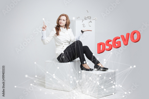 DSGVO, german version of GDPR, concept image. General Data Protection Regulation, protection of personal data. Young woman working with information. Datenschutz-Grundverordnung. photo