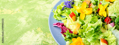 Fresh vegan salad with edible flowers