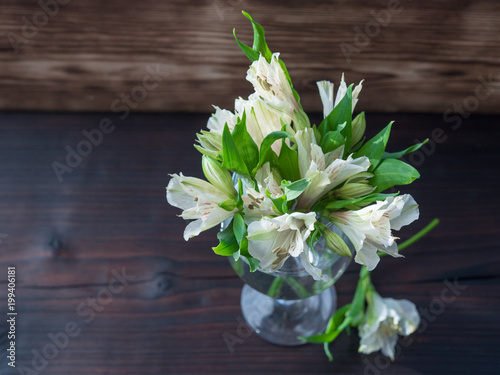 White flowers on dark wooden background, wedding