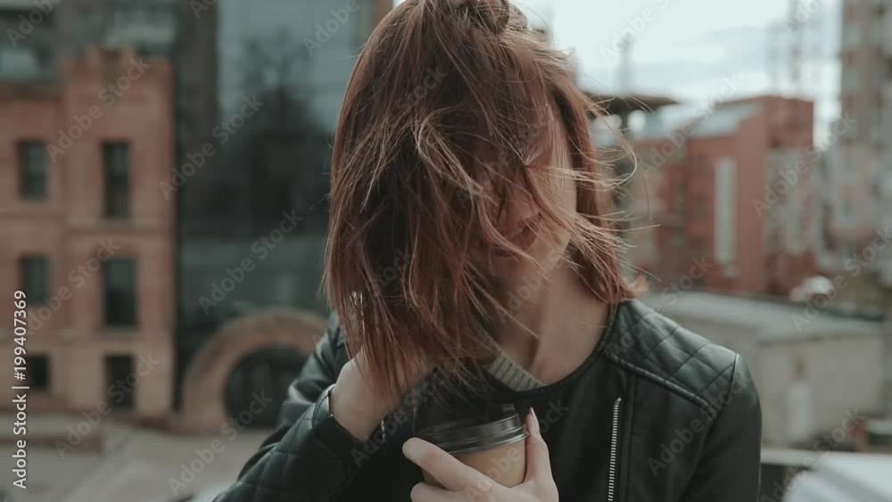 Woman portrait in city with coffee cup Woman portrait in city with coffee cup