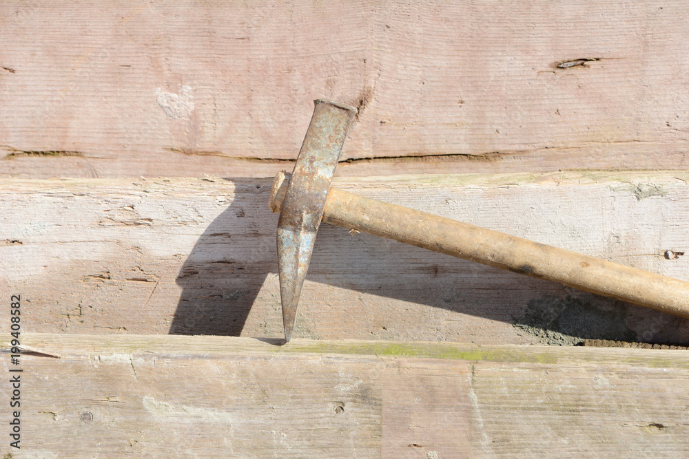 hammer at scaffolding plate on construction site hammer at scaffolding plate on construction site