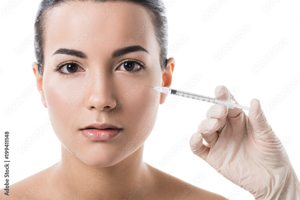 cropped image of beautician making beauty injection to girl with clean skin isolated on white