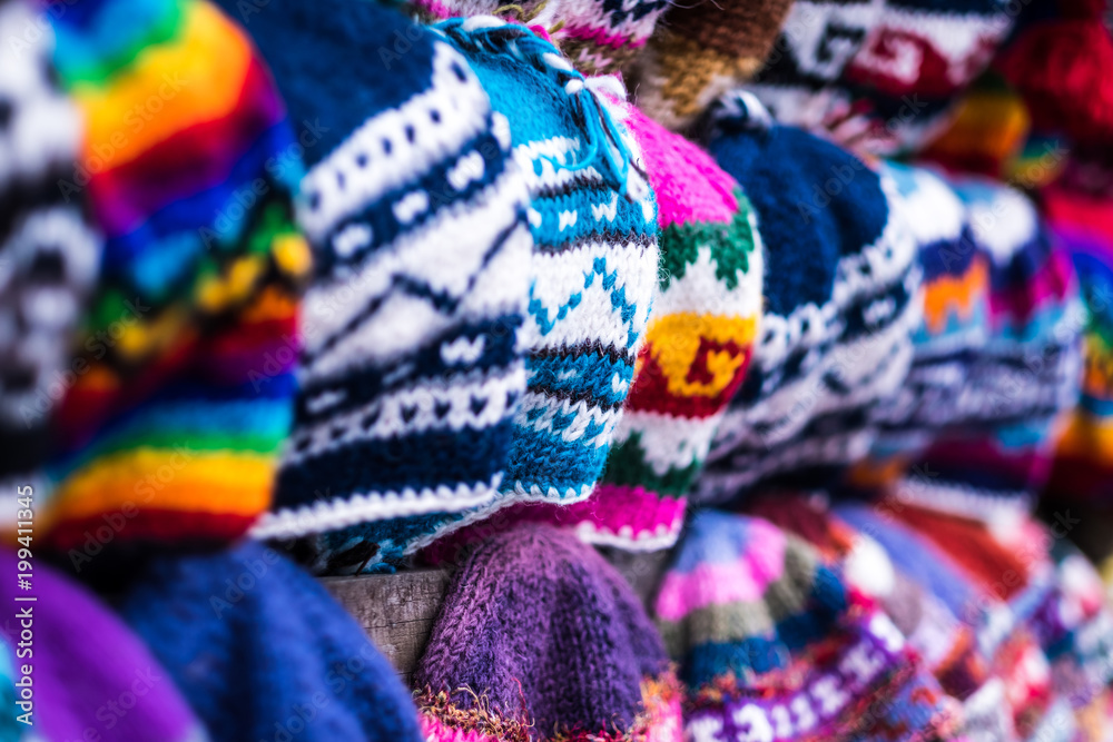 Colorful handmade knitted hats on the Nepalese market, close-up