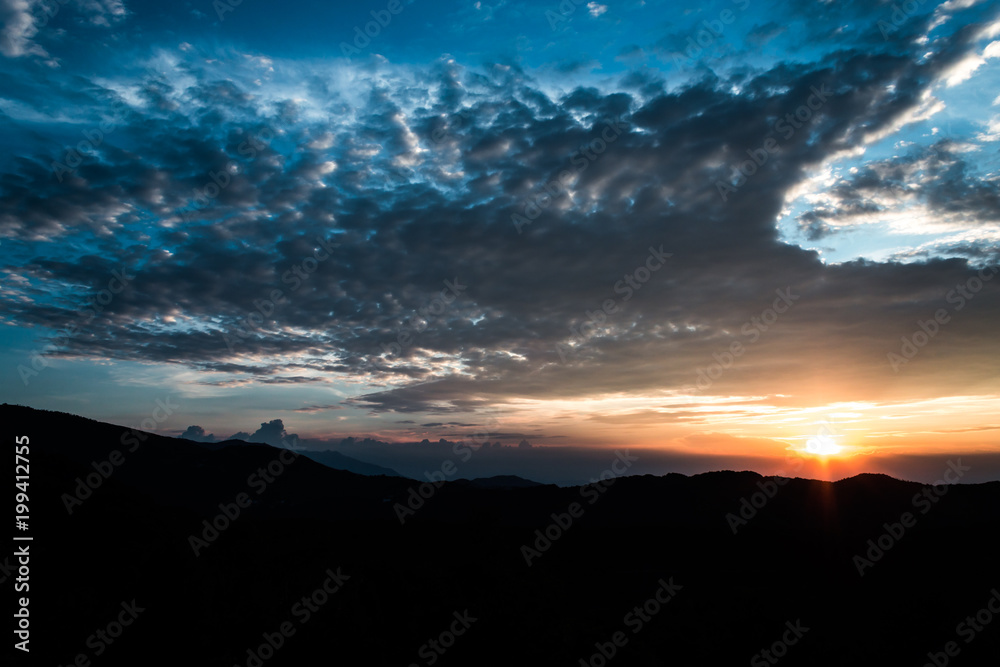 Sunset over Mountain Silhouette