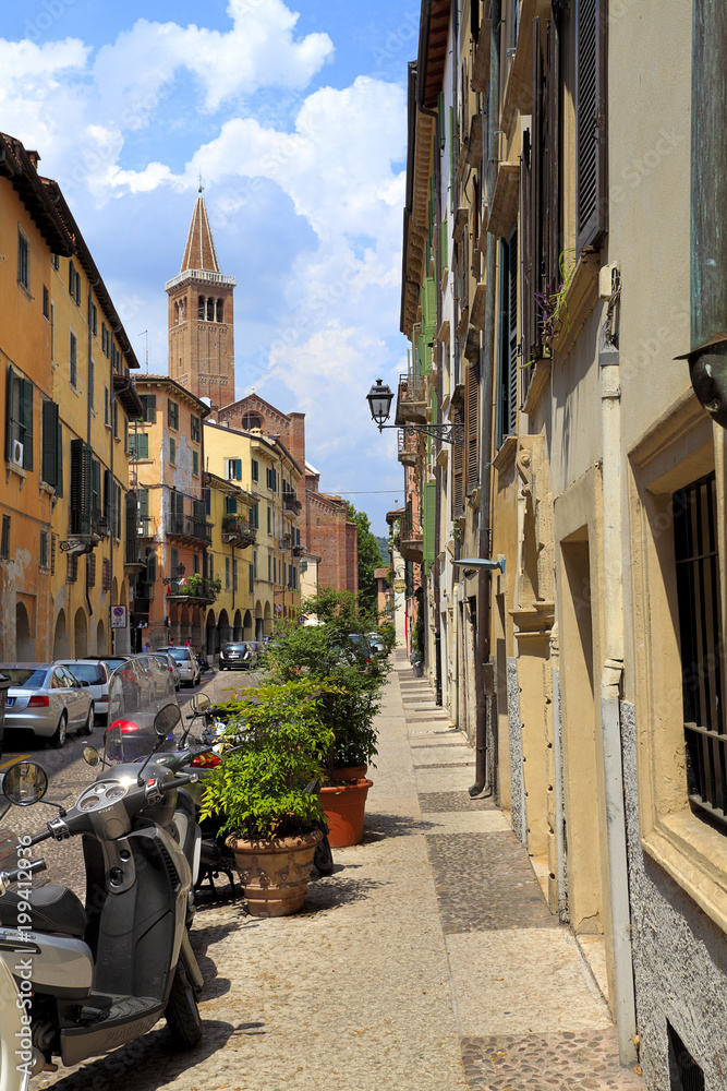 Verona, Italy - historic city center - Corso Sant Anastasia street with St. Anastasia church in the background