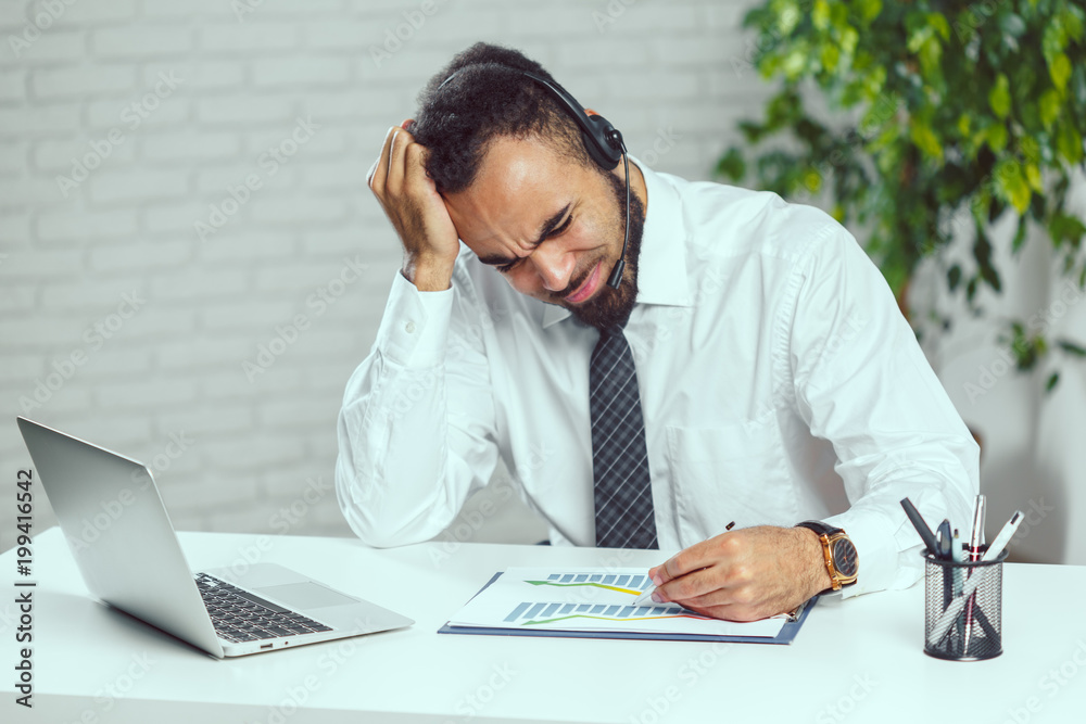 Man with headphones. Call center operator speaking with client Man with headphones. Call center operator speaking with client