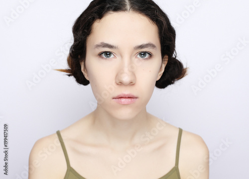 young brunette model on a white background