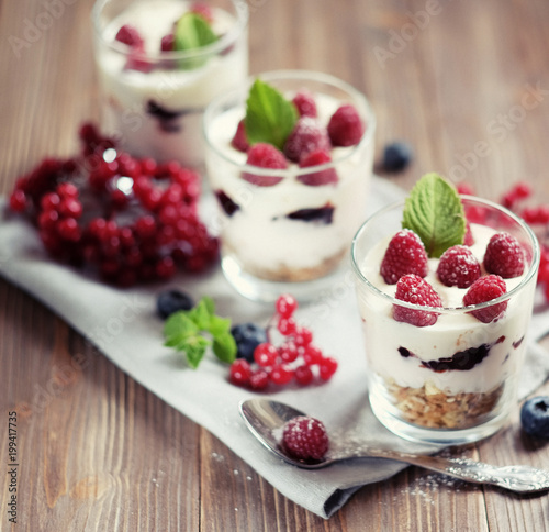 Natural yogurt with fresh berries and muesli. Healthy dessert.