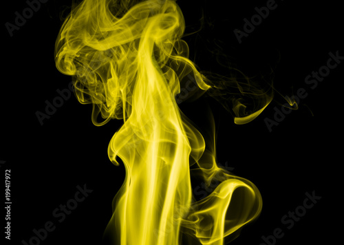 Fototapeta Naklejka Na Ścianę i Meble -  Yellow smoke on black background
