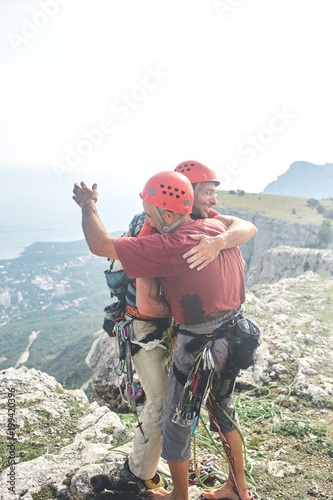 two man rock climbers climbed on the cliff