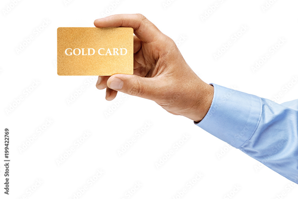 Man's hand in shirt holding gold credit card isolated on white background. High resolution product. Close up. Man's hand in shirt holding gold credit card isolated on white background. High resolution product. Close up.