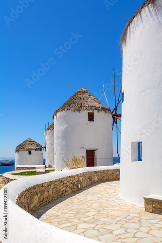 Whitewashed traditional windmill overlooking Mykonos port. Mykonos island  Cyclades  Greece