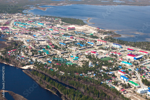 Aerial View of settlement on the bank river © Vladimir Melnikov