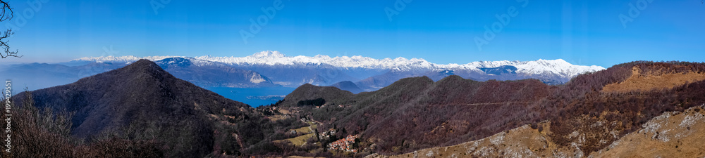 panorama on the Alps and Lake Maggiore from the Lombard pre-Alps, valley of woods and small villages